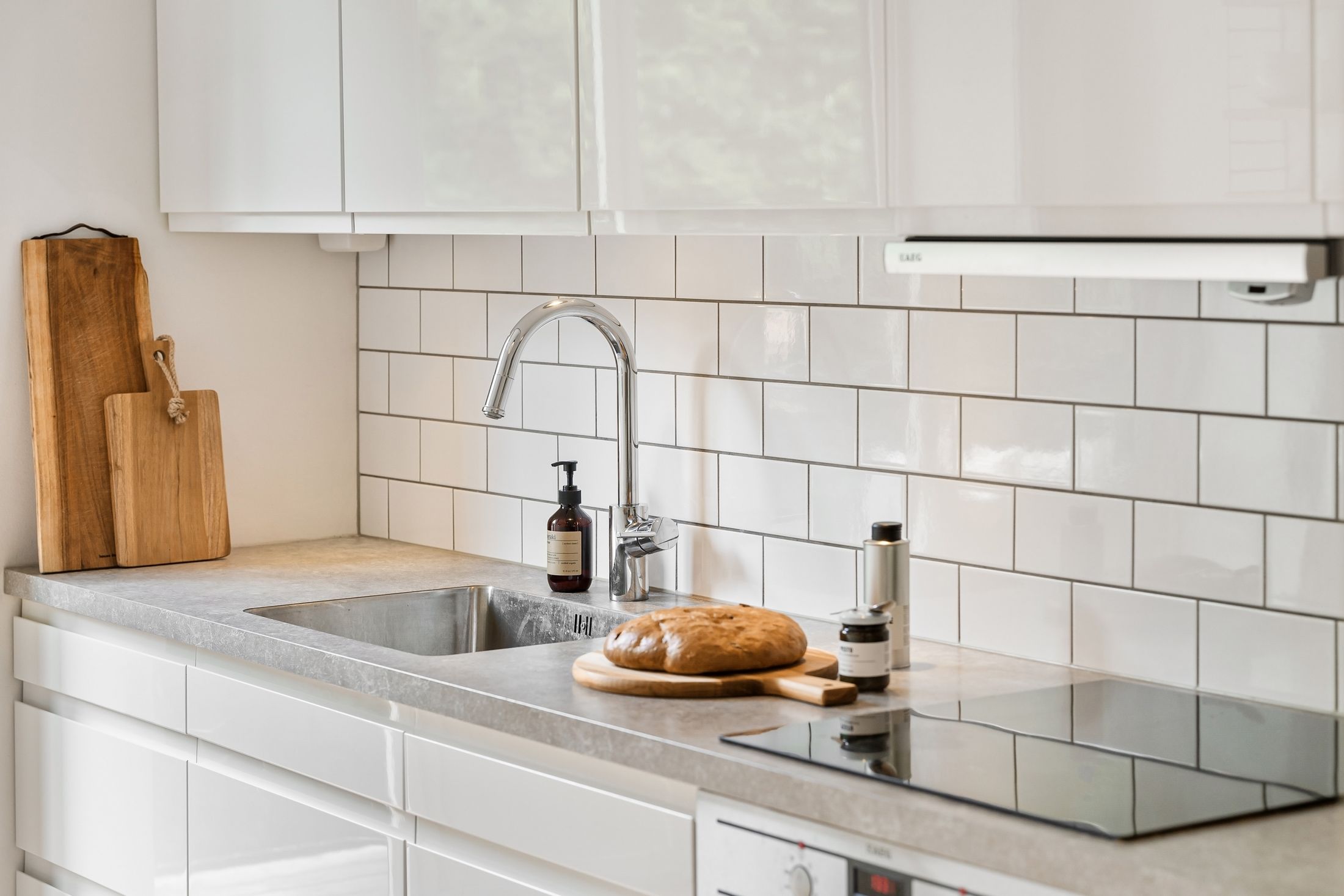 Contemporary kitchen with an installed stainless steel sink